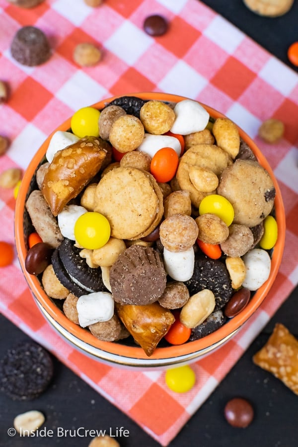 Sweet and Salty Trail Mix - sweet cookies and candies and salty pretzels and peanuts make this homemade snack mix disappear in a hurry! Great recipe for family game nights or movie nights! #snackmix #trailmix #reeses #peanutbuttercups #sweetandsalty #nobake