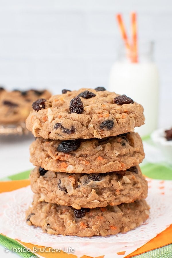 A stack of four raisin carrot cookies stacked on top of each other.