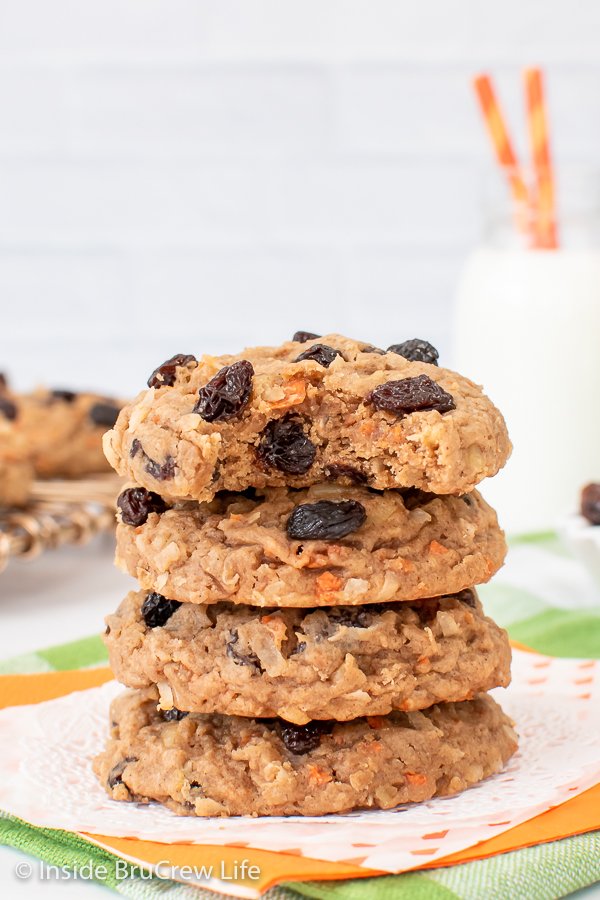 A stack of four raisin carrot cookies stacked on top of each other.