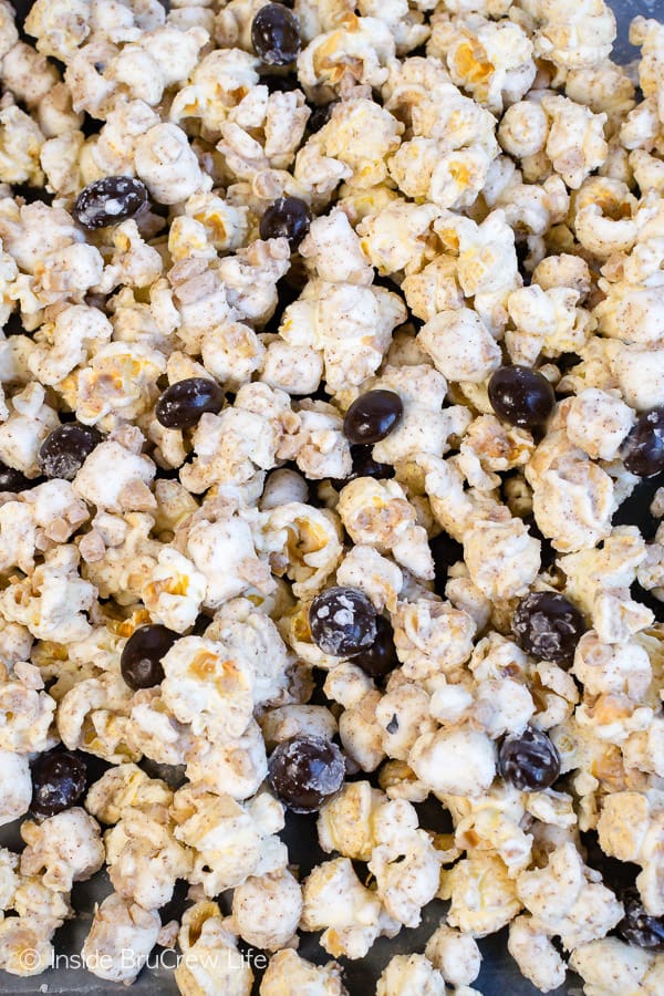 Coffee Toffee Popcorn - coffee infused white chocolate and coffee beans give this snack mix an awesome coffee boost. Make this no bake treat to munch on during movie nights. #coffee #snackmix #popcorn #toffee #nobake #whitechocolate #coffeebeans