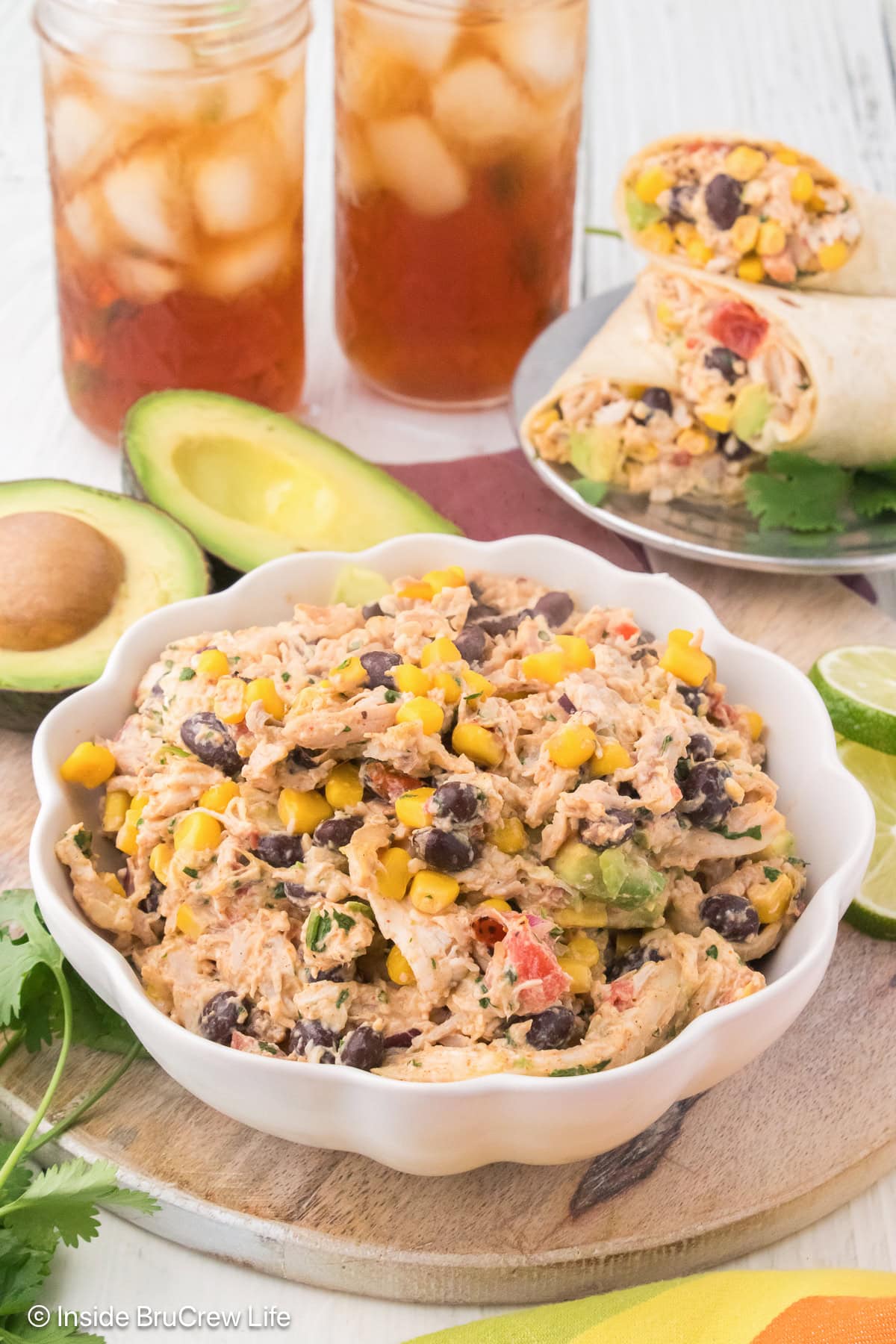 A bowl of creamy taco chicken salad on a tray.