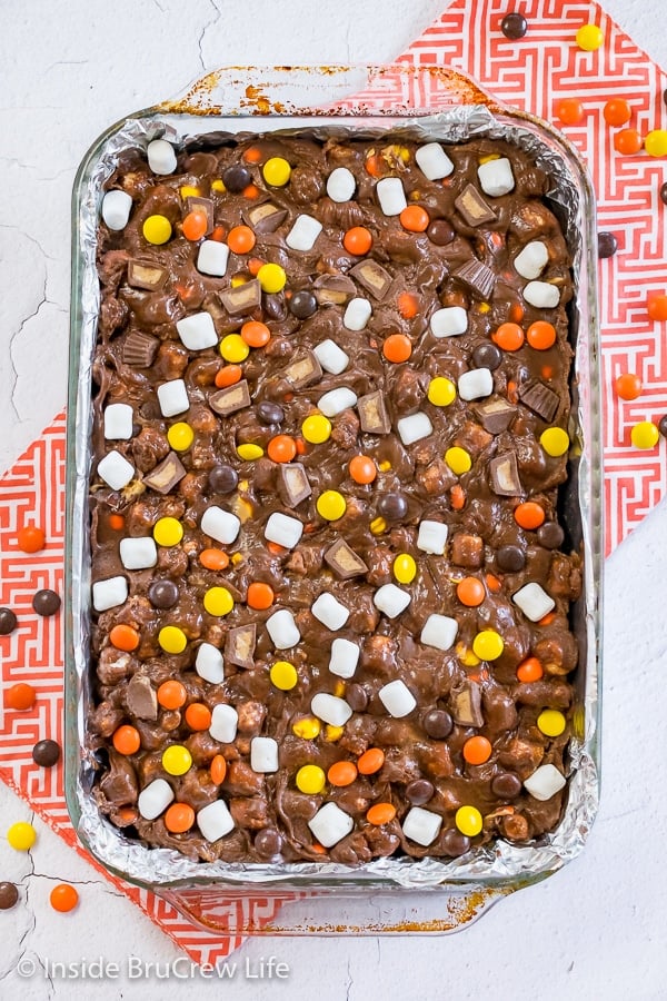 Overhead picture of a pan of Reese's Fluffernutter Fudge Brownies topped with candy and marshmallows