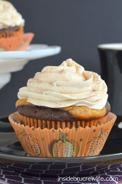 These chocolate cupcakes with a pumpkin cheesecake center and white chocolate cinnamon frosting are perfect for any fall party.