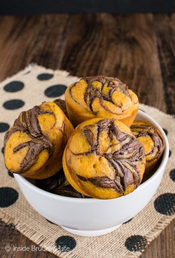 Pumpkin Nutella Muffins - chocolate swirls make these soft muffins disappear every time. Try this recipe for breakfast this fall. #breakfast #muffins #pumpkin #nutella #fall