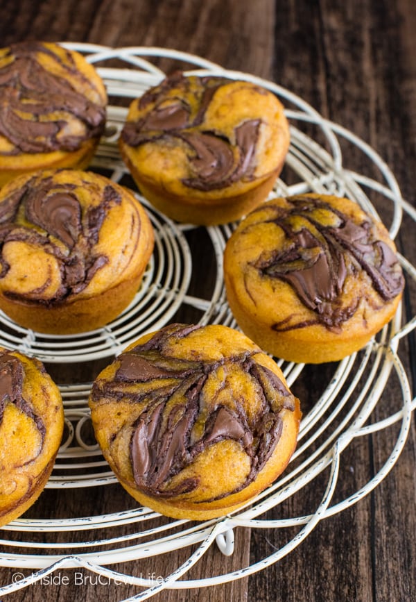 Pumpkin Nutella Muffins - these easy soft pumpkin muffins have a pretty chocolate swirl on top. Great breakfast recipe for the fall. #breakfast #muffins #pumpkin #nutella #fall