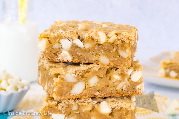 A close up picture of two tropical blonde brownies loaded with white chocolate chips