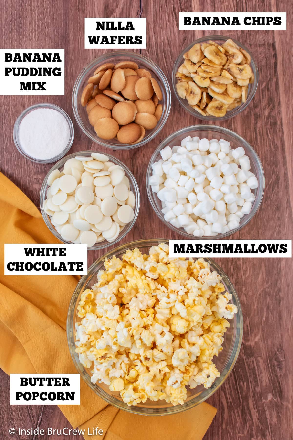 Bowls of ingredients needed to make a banana pudding popcorn recipe.