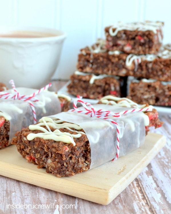 A close up of a peppermint hot chocolate granola bar wrapped in parchment and tied with string