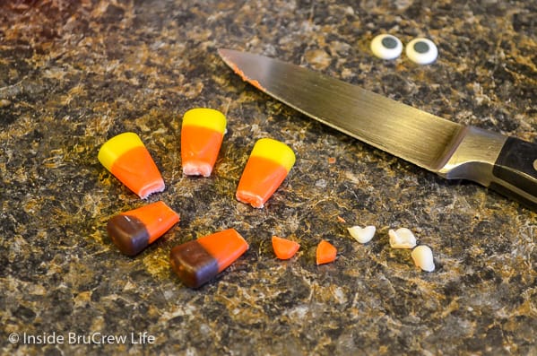 Candy corn on a counter with the tips cut off.