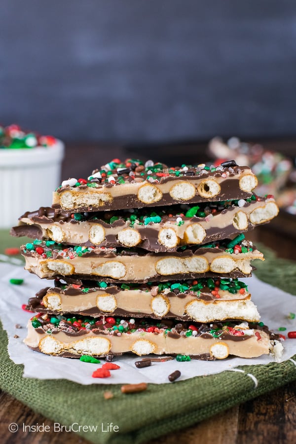 A stack of Salted Caramel Pretzel Bark on a green towel.