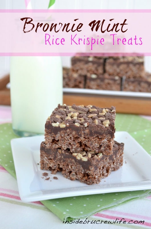 2 chocolate mint rice krispie treats stacked together on a white plate.