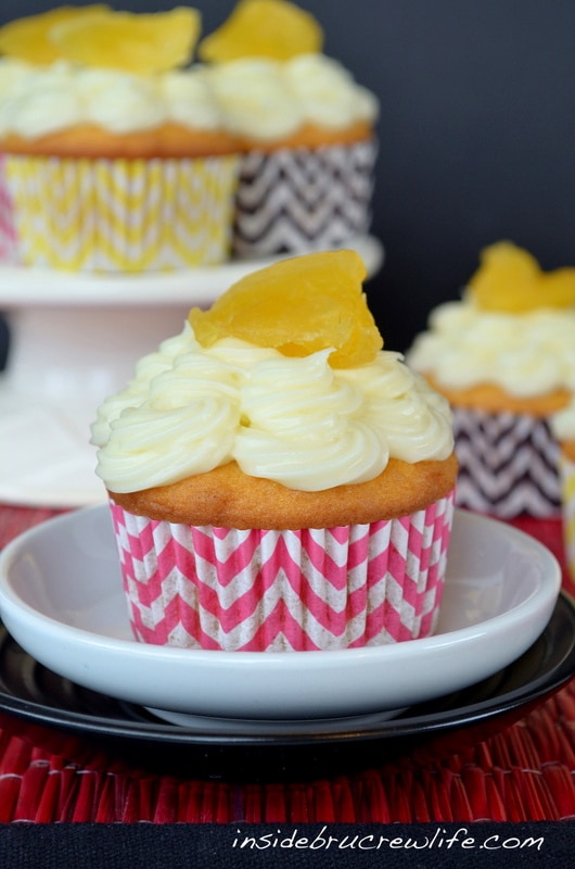 Pineapple Cupcakes - vanilla cupcakes filled with pineapple preserves and topped with cream cheese frosting 