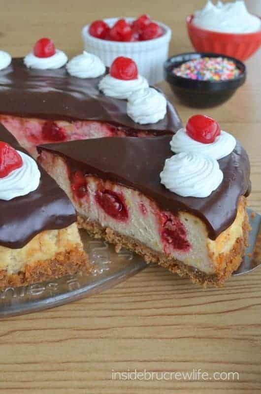 Banana cheesecake swirled with strawberry pie filling and topped with chocolate ganache. This is amazing!