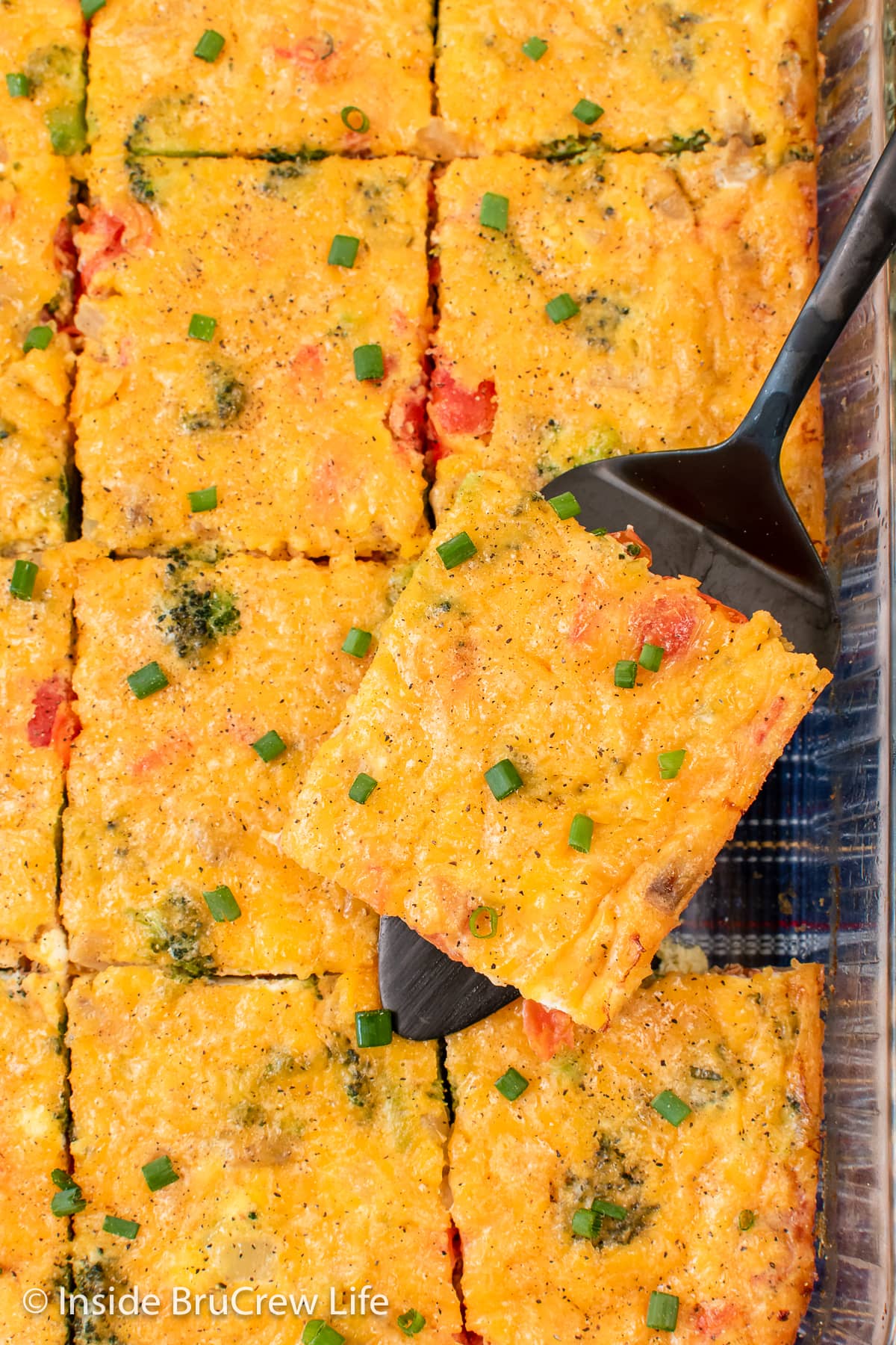 Squares of egg casserole in a dish.