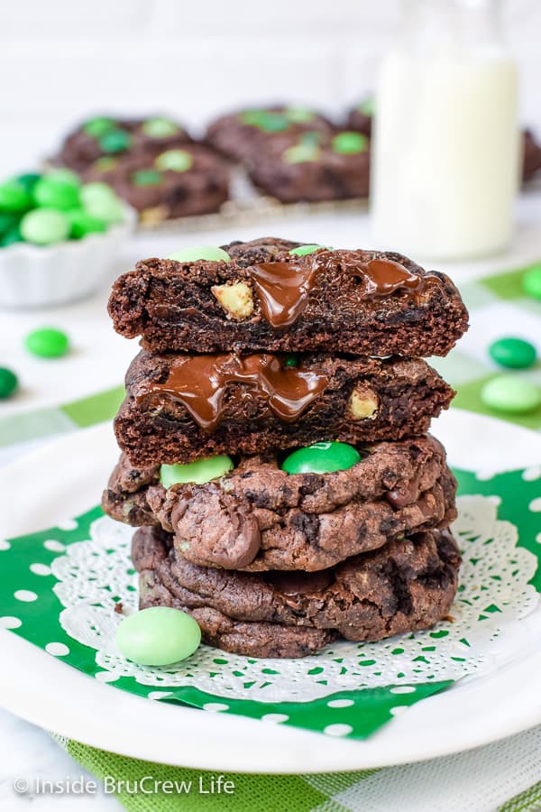 3 gooey chocolate cookies oozing with melting chocolate chips.
