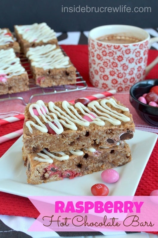 A stack of two Raspberry Hot Chocolate Granola Bars on a white plate