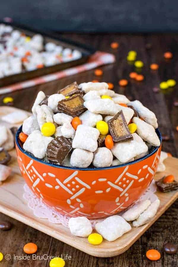 Peanut Butter Cup Puppy Chow - easy snack mix loaded with four kinds of Reese's goodness. Easy recipe to share at parties or events. #peanutbutter #reesespeanutbuttercups #snackmix #nobake #chexcereal #puppychow #muddybuddies