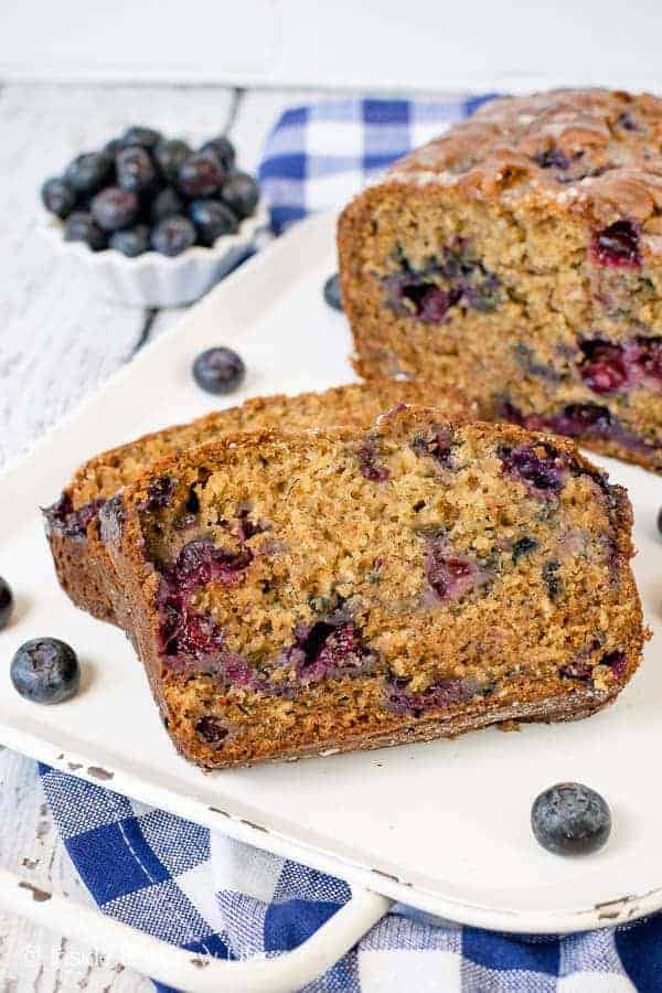 Blueberry Banana Bread - fresh berries, ripe bananas, and yogurt give this classic banana bread a healthy twist. Make this easy recipe for breakfast or an after school snack. #banana #blueberries #sweetbread #healthy #breakfast #bananabread #recipe