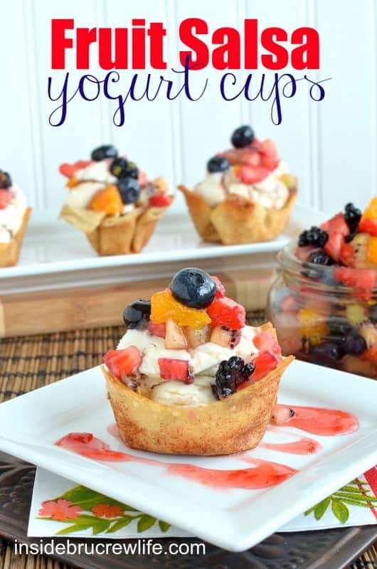 A cinnamon sugar shell on a white plate filled with frozen yogurt and topped with fruit salsa