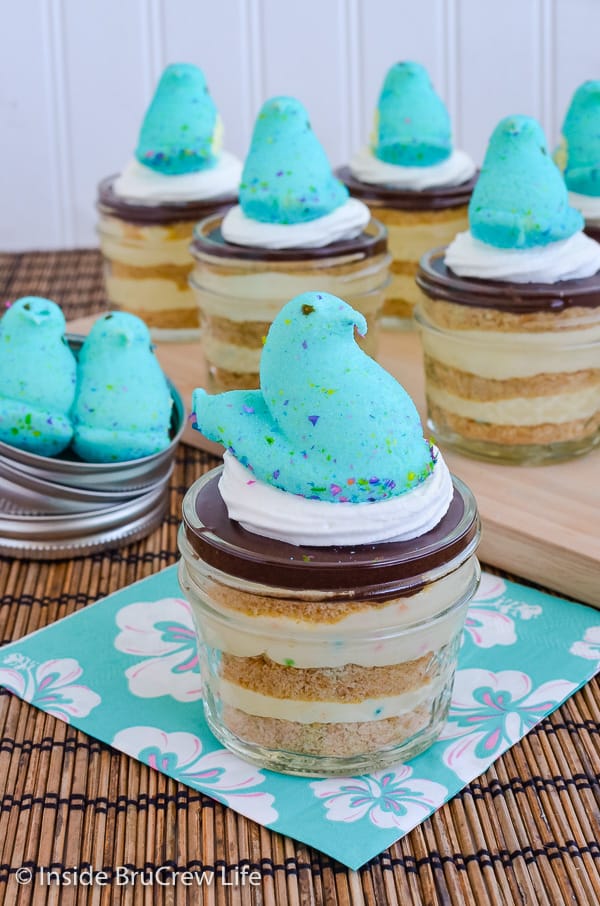 Jars of eclair cake with blue marshmallow Peeps on top