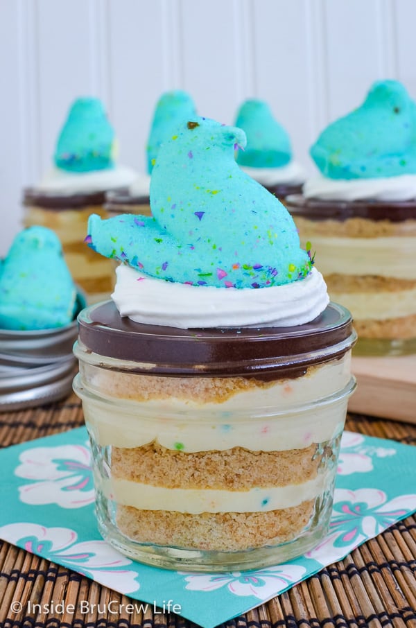 A jar of eclair cake with a blue marshmallow Peep on top