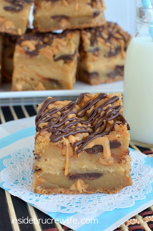 Peanut Butter Cheesecake Cookie Bars - peanut butter cookies layered with peanut butter cheesecake and chocolate! Awesome dessert recipe!