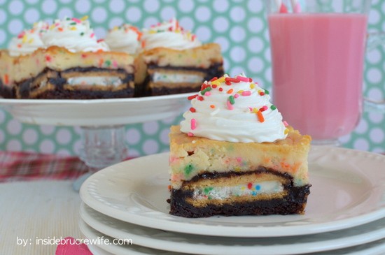 Brownies with Oreo cookies inside and cake batter cheesecake on top is the perfect dessert for celebrating anything!