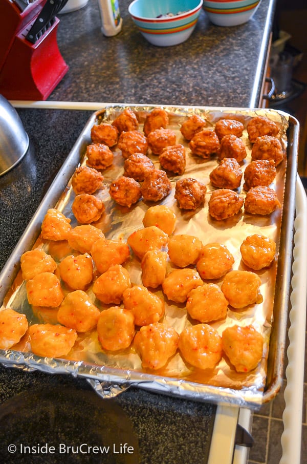 A sheet pan with chicken bites on it