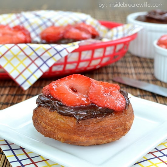 Dirty Berry Doughnuts | Inside BruCrew Life - fried biscuit dough topped with fudge frosting and grilled strawberries #doughnuts #strawberries