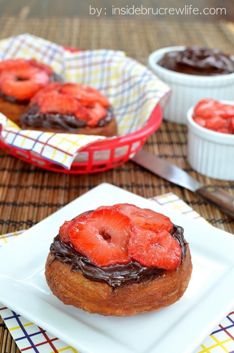 Dirty Berry Doughnuts | Inside BruCrew Life - fried biscuit dough topped with fudge frosting and grilled strawberries #doughnuts #strawberries