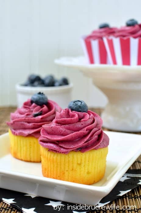 These easy lemon cupcakes filled with lemon curd and topped with blueberry butter cream are refreshing and delicious.