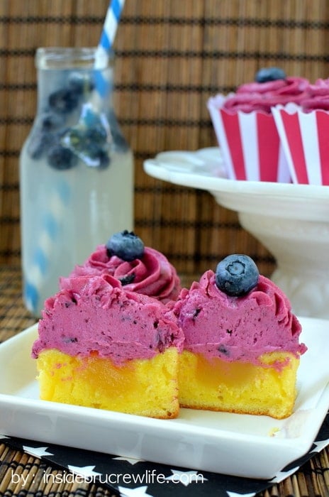 These easy lemon cupcakes filled with lemon curd and topped with blueberry butter cream are refreshing and delicious.