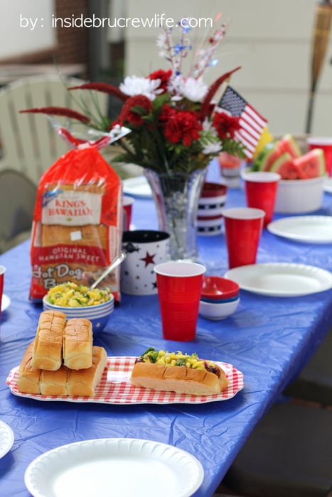 Backyard picnic with King's Hawaiian Rolls, hot dogs, and pineapple mango salsa