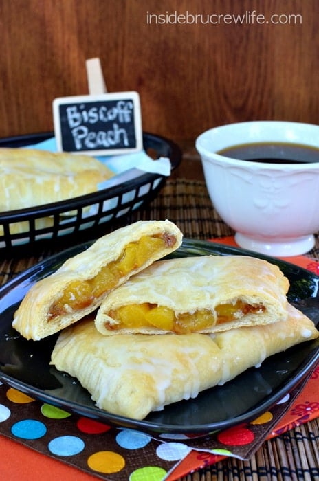 Biscoff Peach Empanadas - little hand help pies filled with peach pie filling and cookie butter! Awesome dessert recipe!