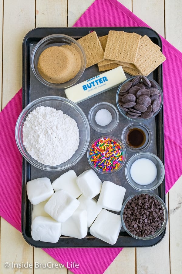 A metal tray with all the ingredients needed to make no bake cookie dough s'mores