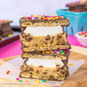 A no bake cookie dough s'mores cut in half and stacked on top of each other showing the layers