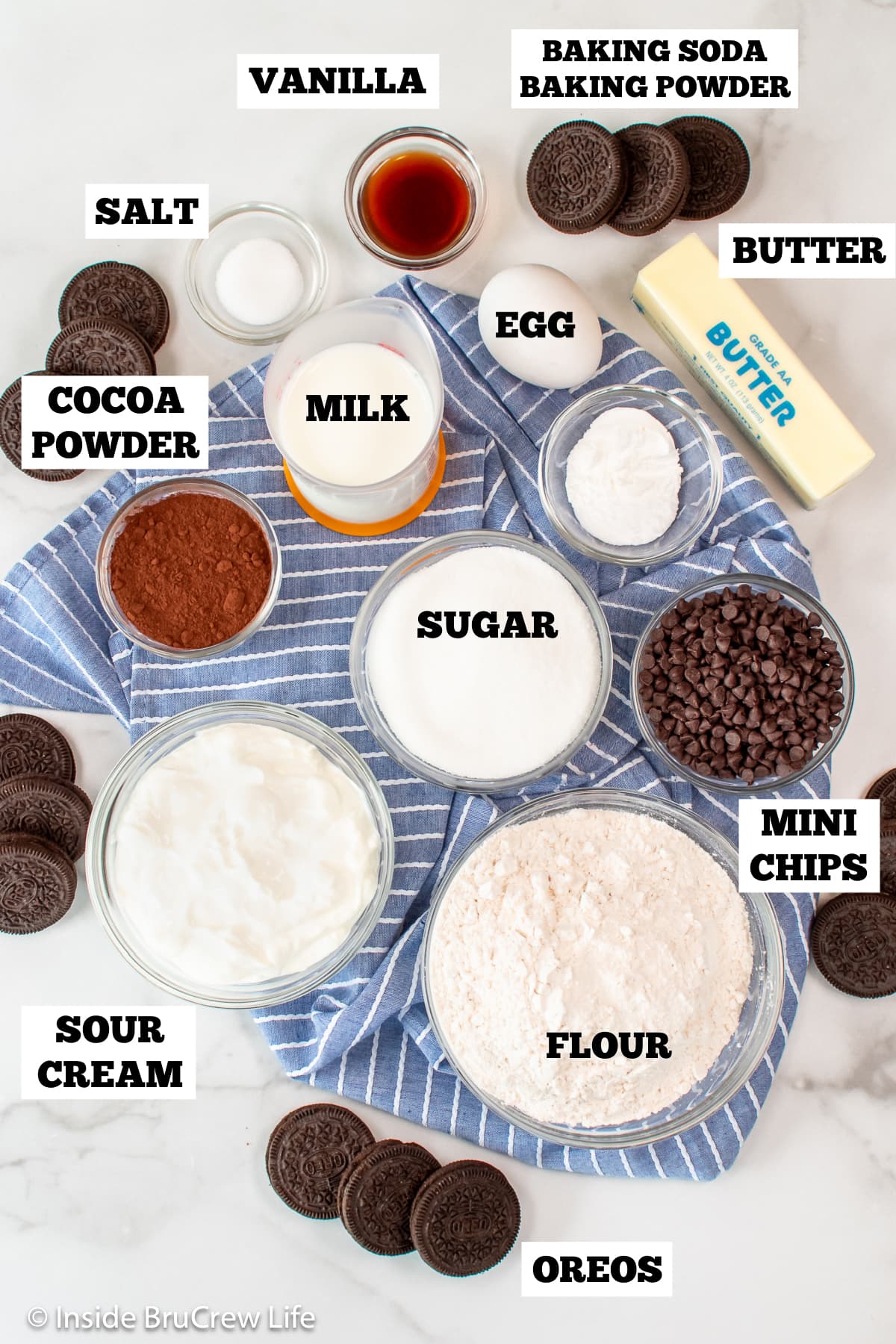 Bowls of ingredients needed to make chocolate muffins.