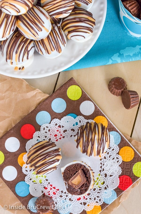 Overhead picture of a plate and napkin with chocolate peanut butter cup cookie dough truffles stacked on them