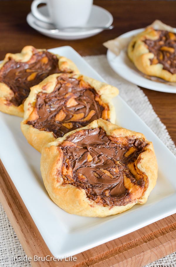 Pumpkin Nutella Cheesecake Danish - this easy cream cheese danish has chocolate and pumpkin cheesecake swirls baked on top. Make this easy recipe for breakfast or dessert this fall.