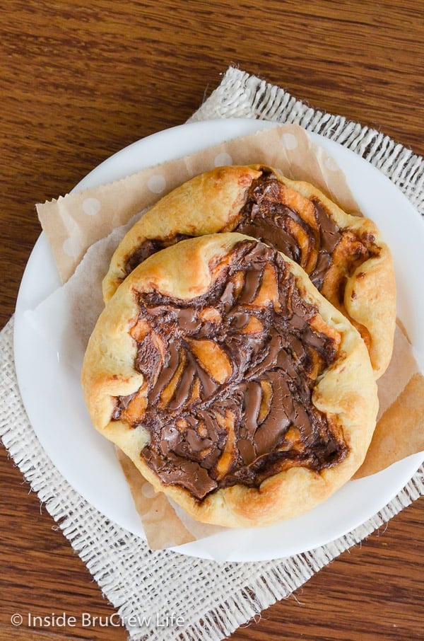 Pumpkin Nutella Cheesecake Danish - this easy cream cheese danish has chocolate and pumpkin cheesecake swirled on top. Try this easy recipe for breakfast or brunch this fall.