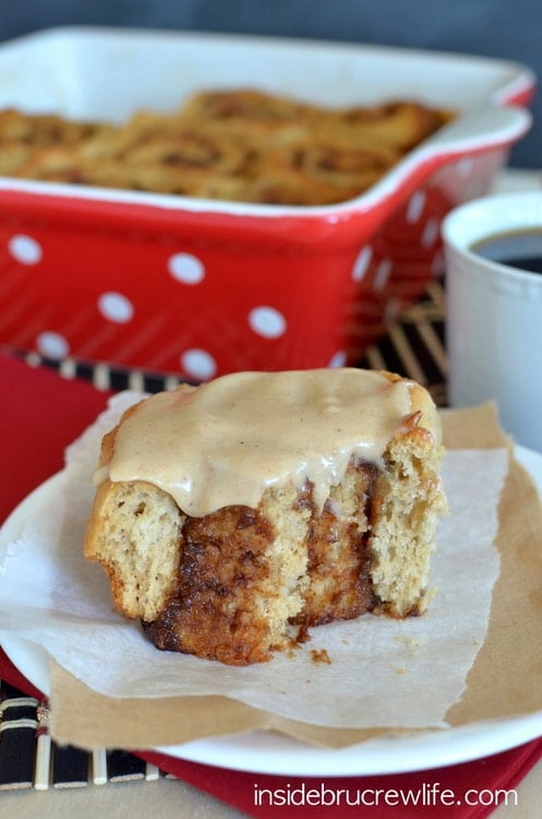 A white plate with an apple butter cinnamon roll on it