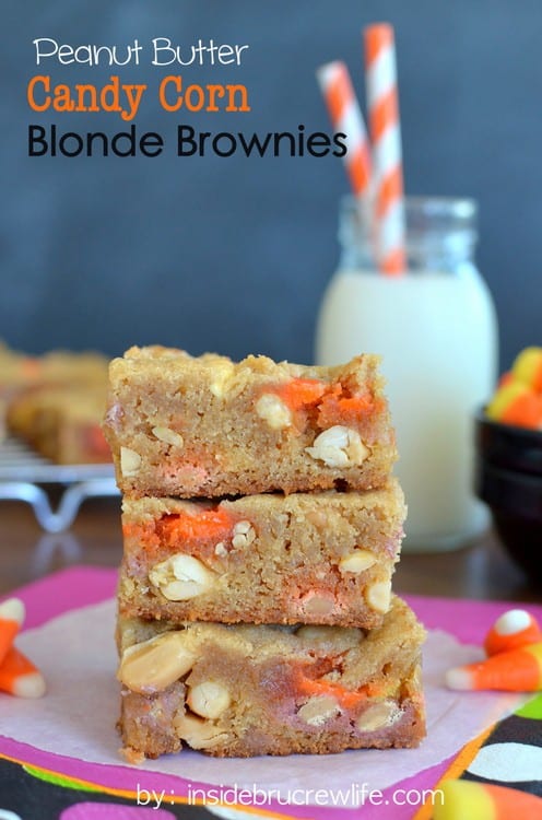 Peanut Butter Candy Corn Blonde Brownies - peanuts, candy corn, and Reese's pieces inside a peanut butter blonde brownie www.insidebrucrewlife.com