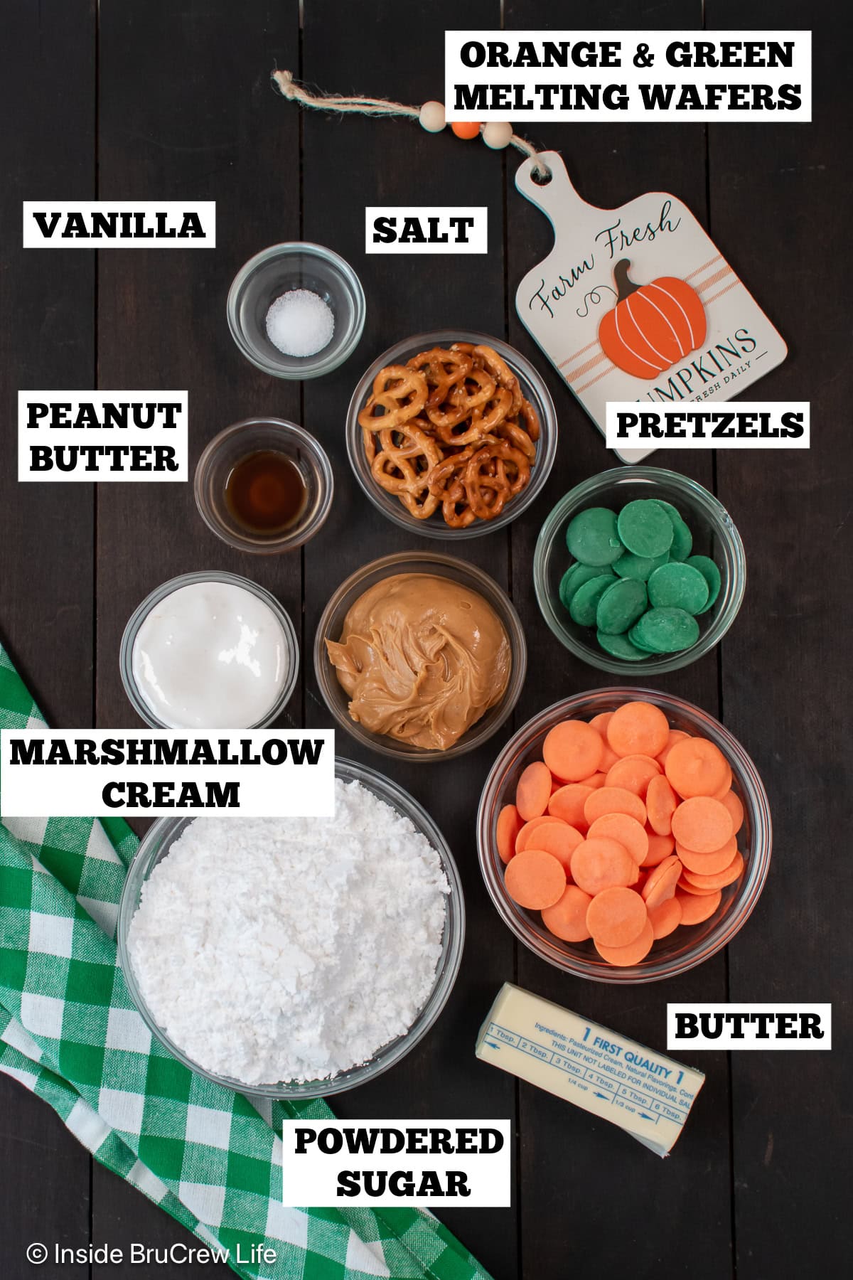 Bowls of ingredients needed to make candy pumpkins.