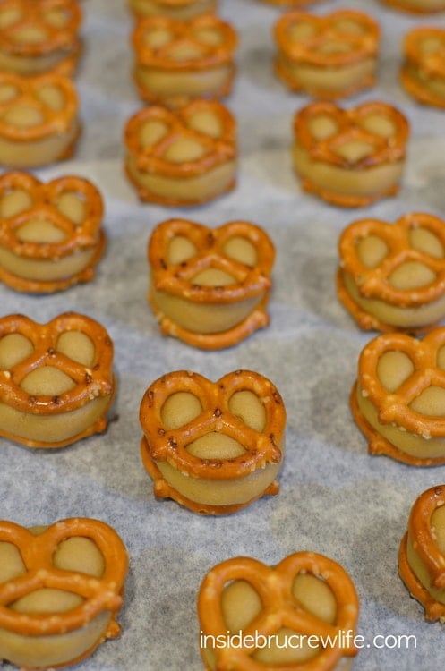 Caramel Pretzel Cookie Dough Bites from www.insidebrucrewlife.com - no bake caramel cookie dough in between pretzels and dipped in chocolate