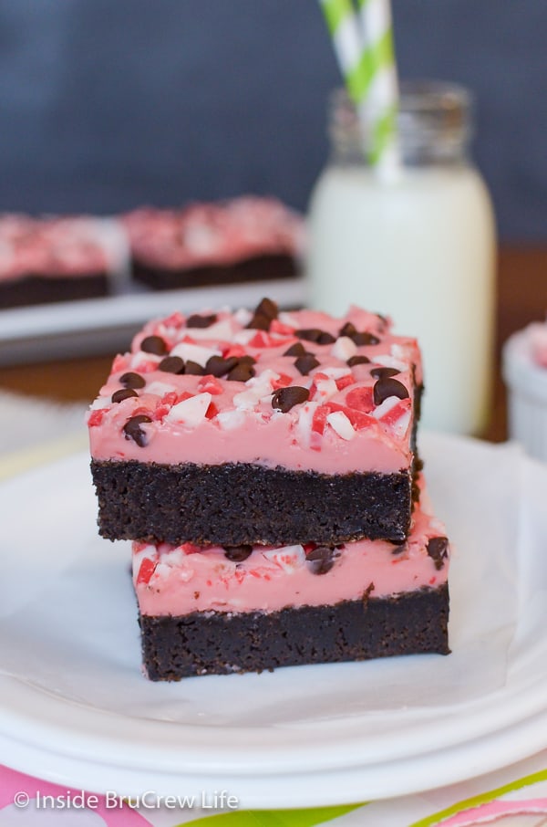 Two Peppermint Chip Brownies stacked together on a white plate.