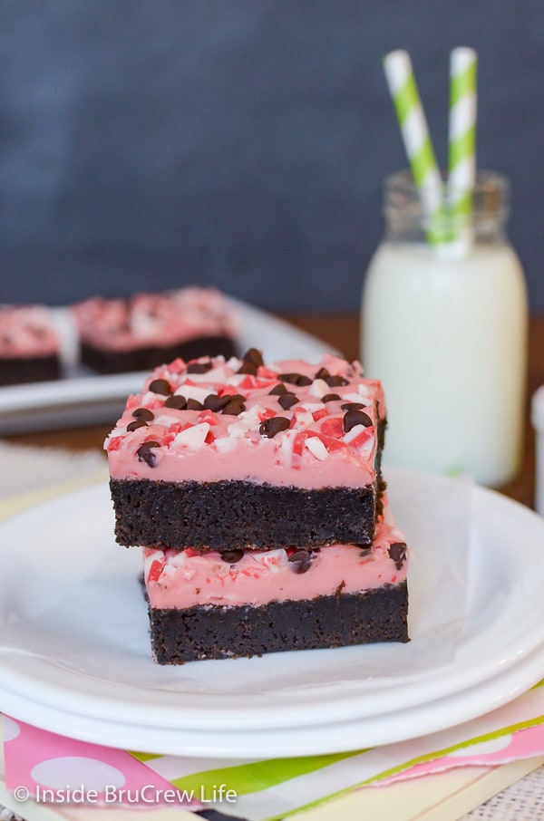 Two Peppermint Chip Brownies on a plate ready to be eaten.