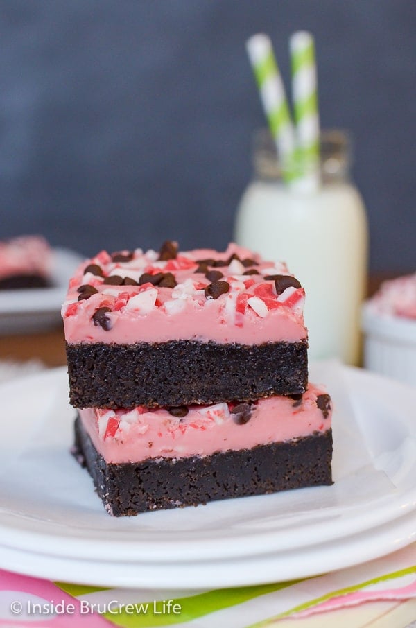 Two Peppermint Chip Brownies stacked together on a white plate.