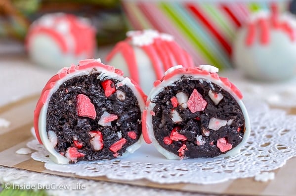 Two Peppermint Crunch Oreo Truffles cut in half on a white doily