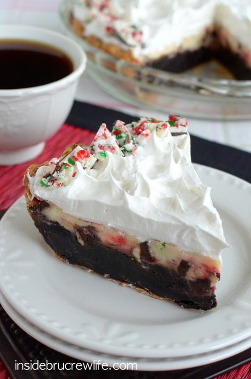 Brownie pie topped with a fun peppermint bark cheesecake is a perfect holiday dessert!