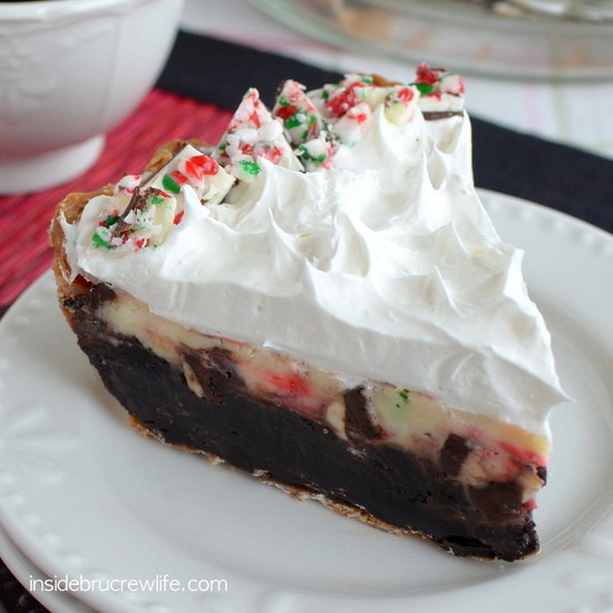 Brownie pie topped with a fun peppermint bark cheesecake is a perfect holiday dessert!